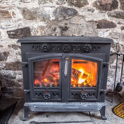 Should You Install a Fireplace or a Wood Stove?